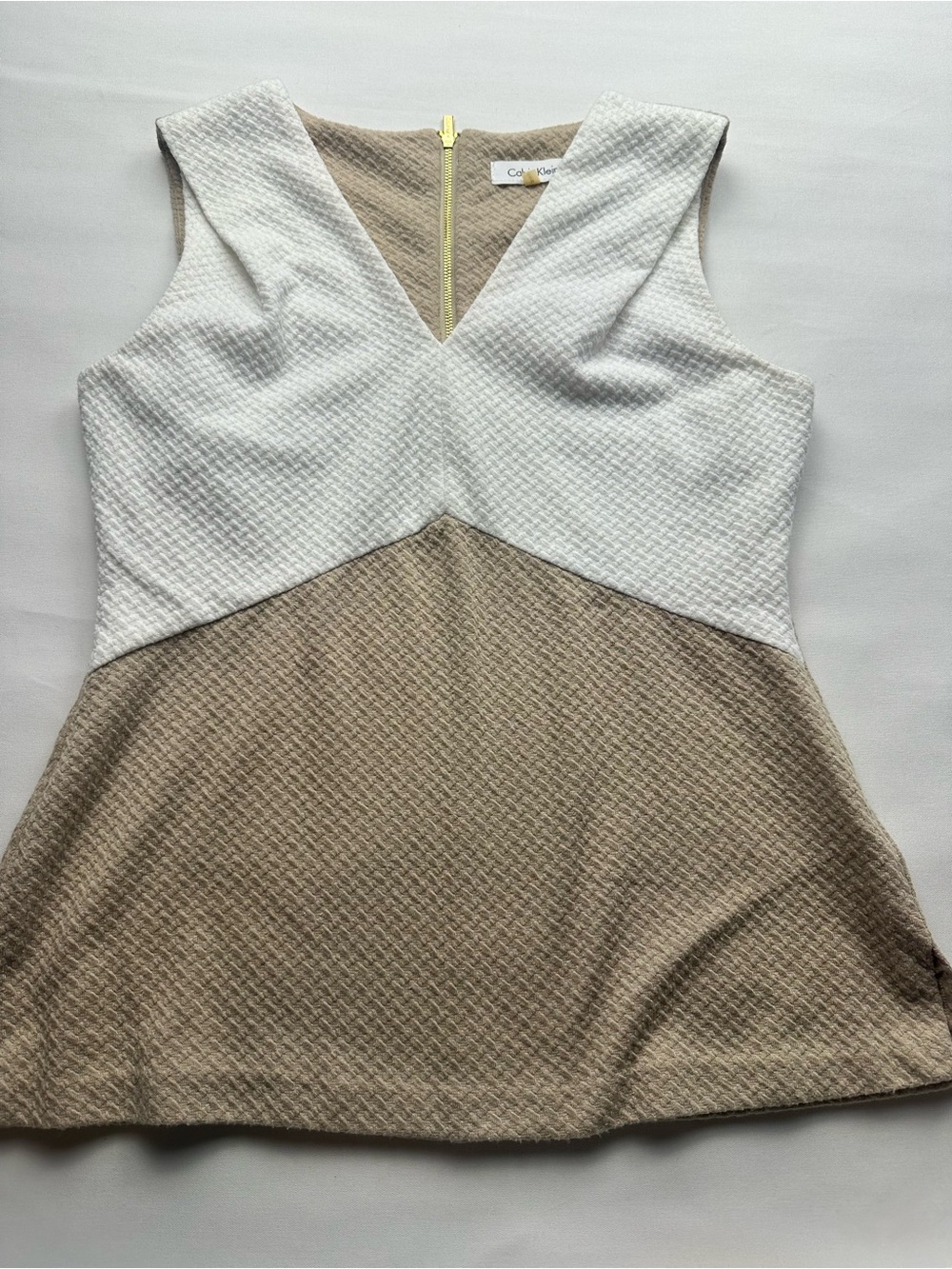 Calvin Klein Beige and cream Textured Zip back V neck Top.